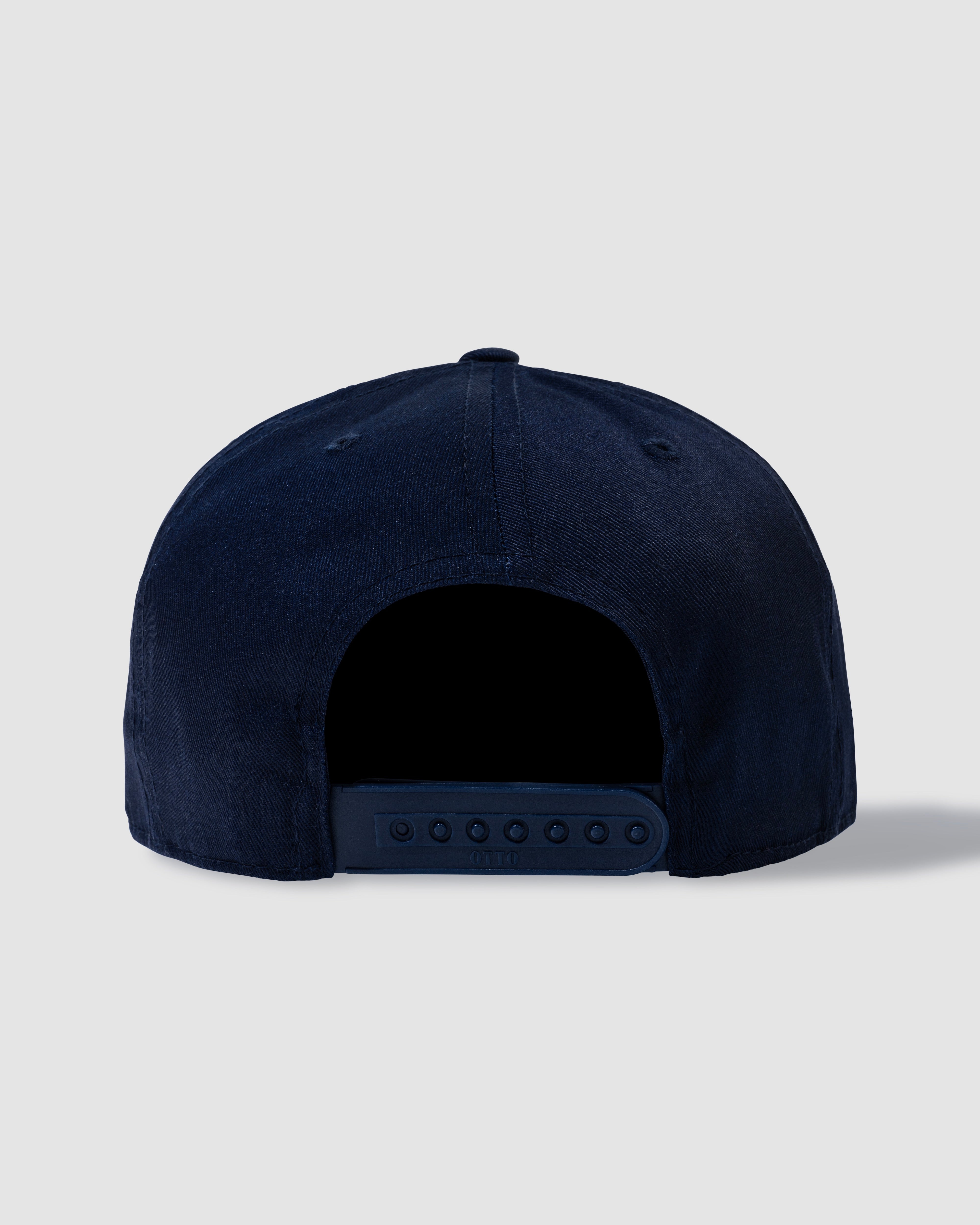 Men’s and unisex ink blue trucker hat with Bashed Laundry embroidery, front view